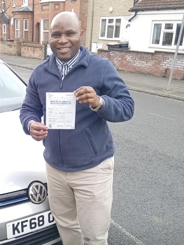 Pupil holding their driving test pass certificate in Enfield