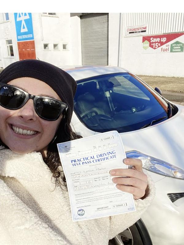 Learner celebrating passing the automatic driving test